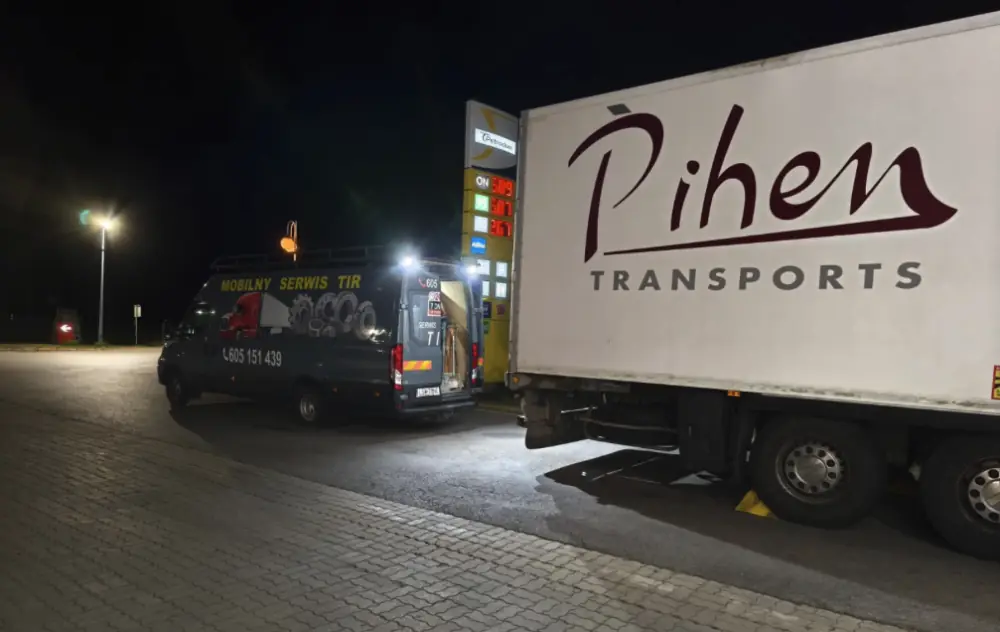 Service van at the semi-trailer during the night-time axle repair