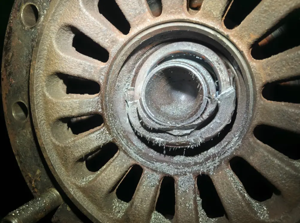 Destroyed SAF axle wheel hub covered in metal filings after removal from the trailer