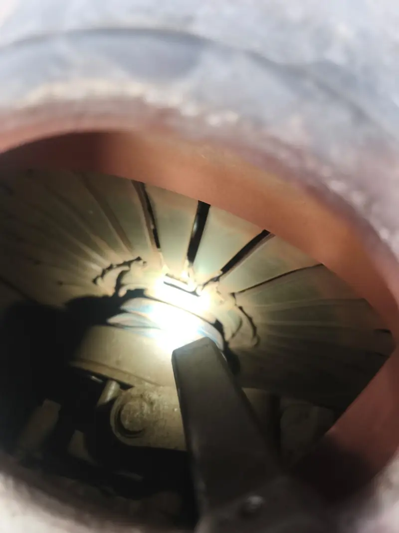 Clutch diaphragm spring fingers lit by a torch through the clutch housing opening